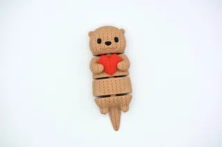 Knitted Flexi Otter With Heart photo 1